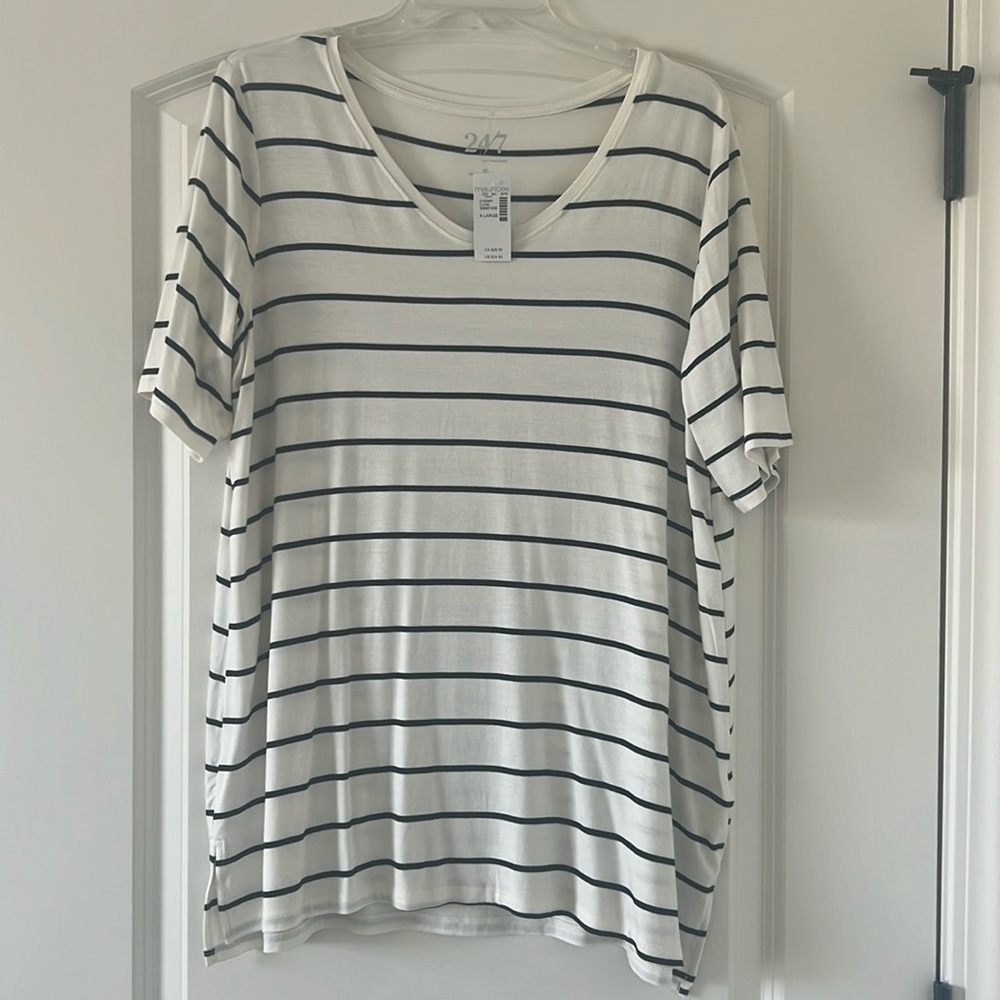 Maurice’s white shirt with black stripes